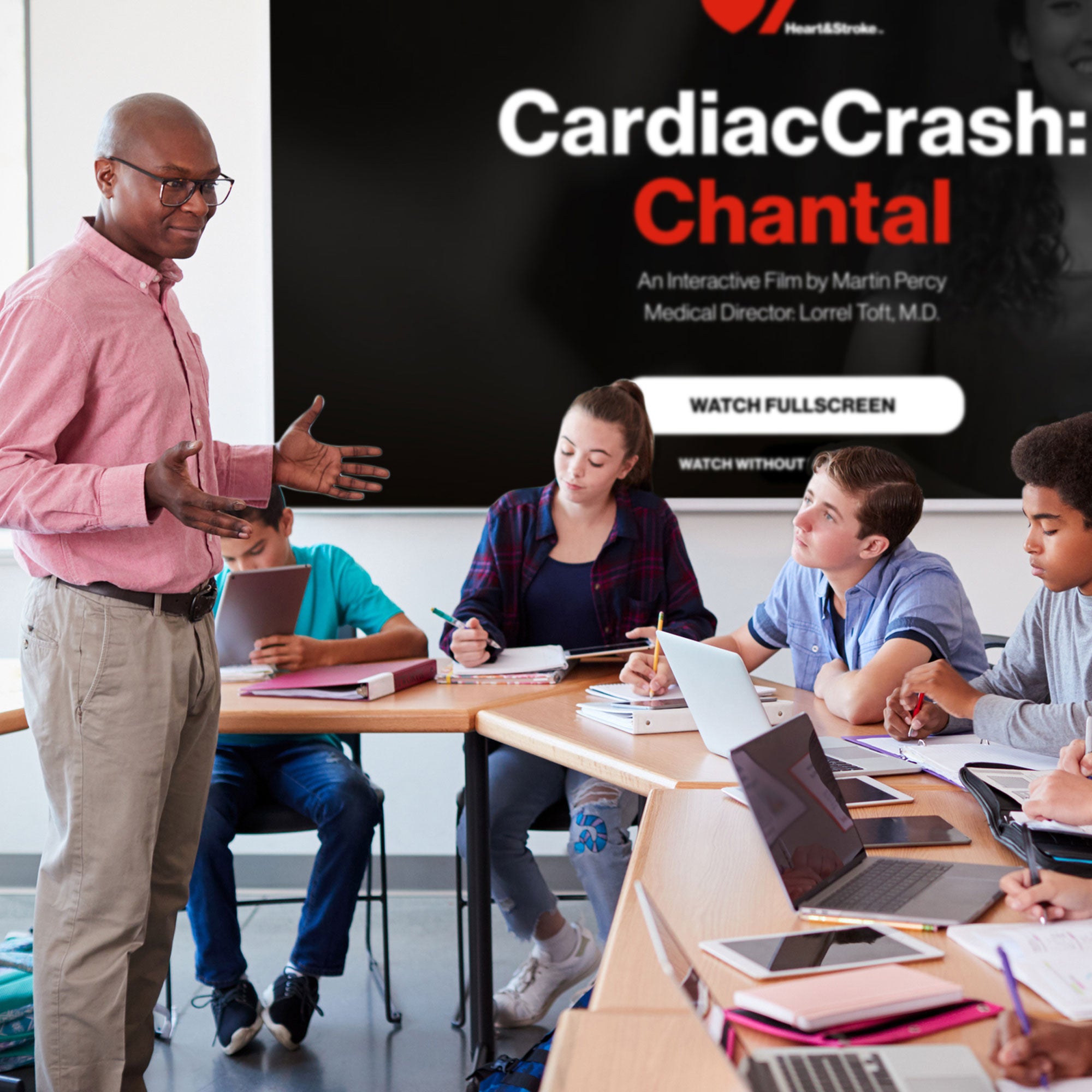 A man in his 40s facilitating a CardiacCrash course for a group of teens in a classroom